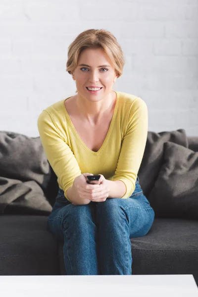 Attractive Woman Using Remote Controller Smiling Camera — Stock Photo, Image