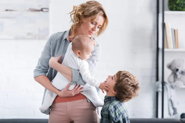 Mother Holding Infant Child Looking Cute Preteen Son Home — Stock Photo, Image