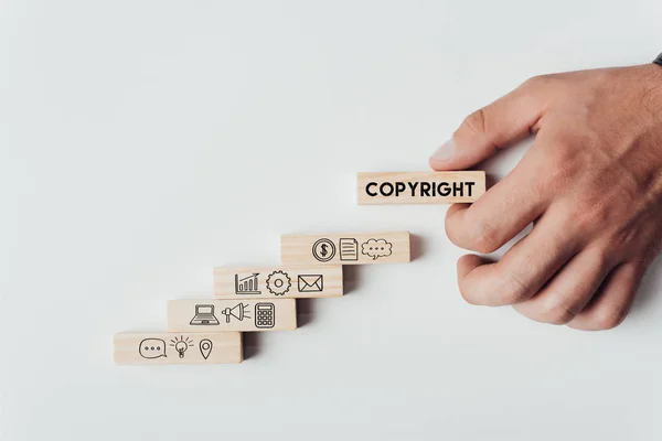Cropped View Man Holding Wooden Block Word Copyright Top Wooden — Stock Photo, Image