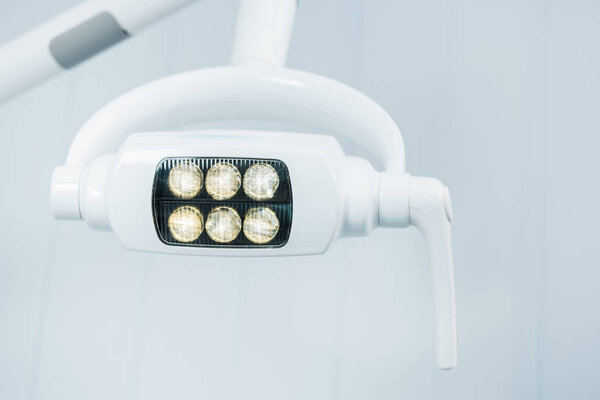 close up of modern surgical lamps in dental clinic 