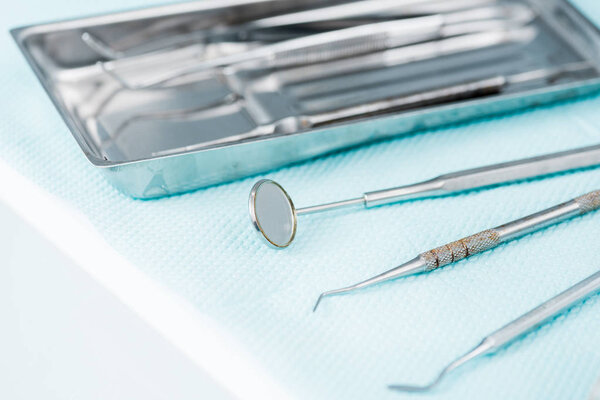 close up of metallic medical instruments in dental clinic 
