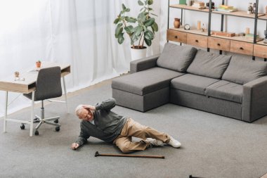 old man falled down on floor of the room clipart