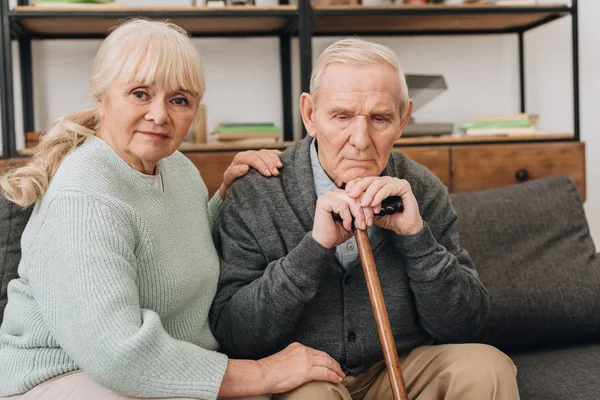 Supportive Senior Wife Sitting Retired Husband Walking Cane Living Room — Stock Photo, Image