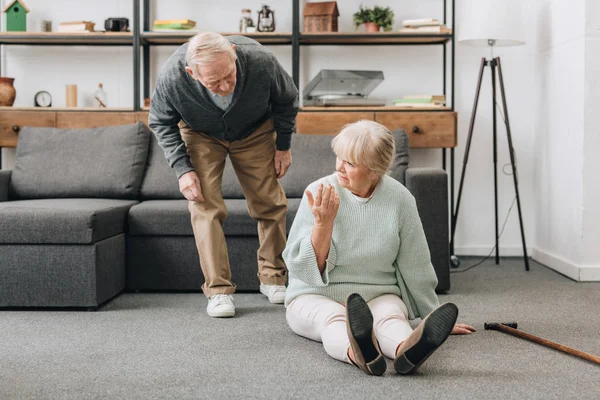 Retired Husband Coming Upset Senior Wife Sitting Floor Walking Cane — Stock Photo, Image