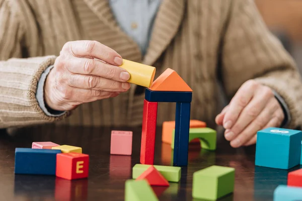 Cropped View Senior Man Playing Wooden Toys Table — Stock Photo, Image