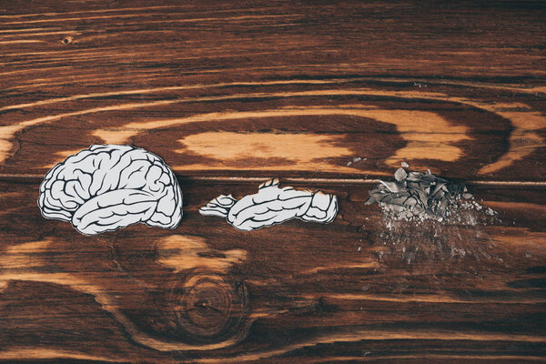 top view papers with brain disease as dementia symbol on wooden table