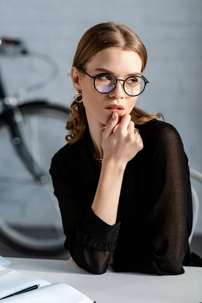 Attractive Businesswoman Black Clothes Sitting Chair Touching Chin — Stock Photo, Image