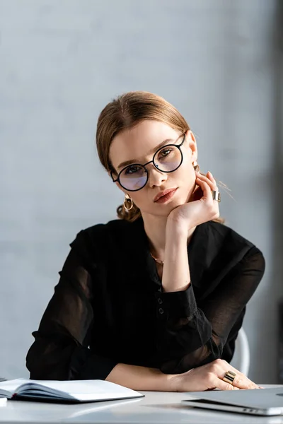 Beautiful Businesswoman Black Clothes Glasses Sitting Chair Looking Camera — Stock Photo, Image