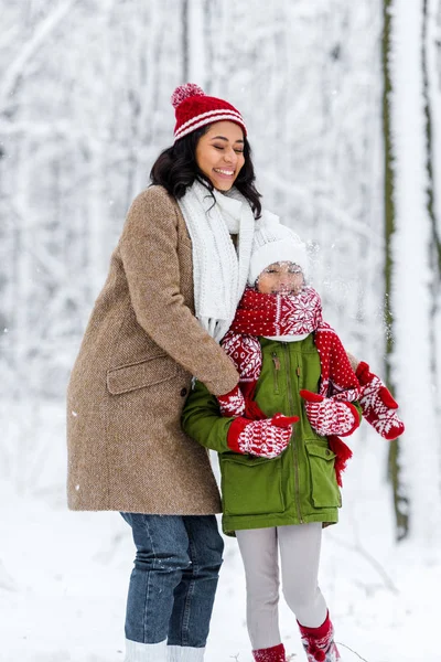 Cheerful African American Mom Closed Eyes Hugging Preteen Daughter Winter — Stock Photo, Image