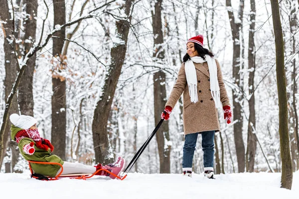 Attractive African American Woman Pulling Preteen Daughter Sledge Smiling Winter — Stock Photo, Image
