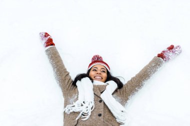 attractive african american woman doing snow angel clipart