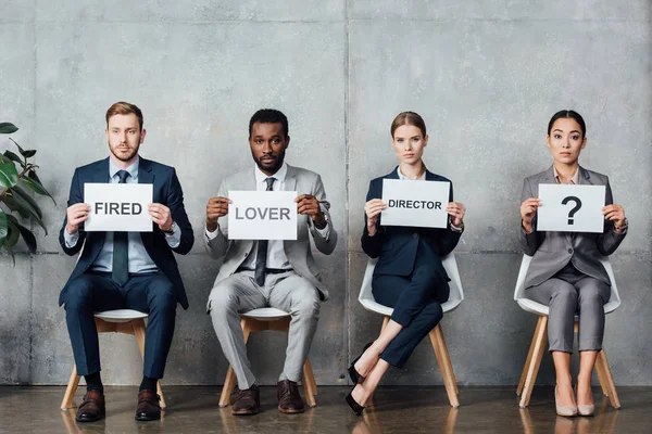 Multiethnic Businesspeople Holding Cards Lover Director Fired Words Question Mark — Stock Photo, Image