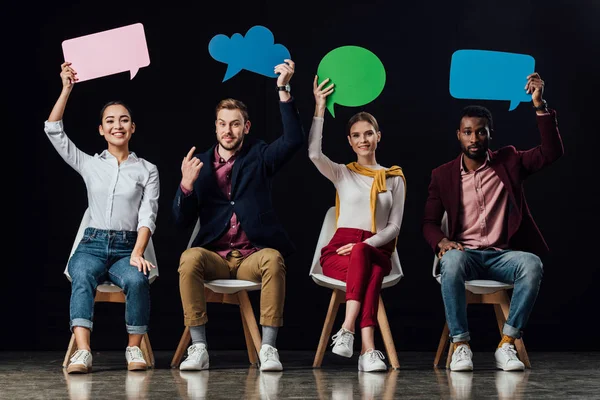 Multiethnic People Sitting Holding Speech Bubbles Thought Bubble Isolated Black — Stock Photo, Image