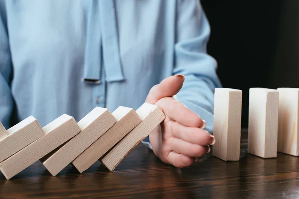 Close View Woman Sitting Desk Preventing Wooden Blocks Falling Hand — Stock Photo, Image