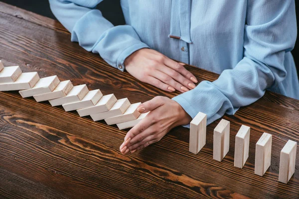 Partial View Woman Desk Preventing Wooden Blocks Falling Hand — Stock Photo, Image