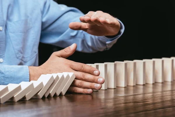 Selective Focus Man Preventing Wooden Blocks Falling — Stock Photo, Image