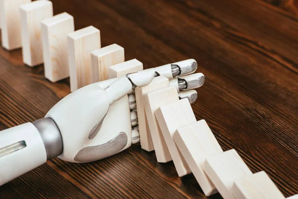 Selective Focus Robotic Hand Preventing Wooden Blocks Falling Desk — Stock Photo, Image