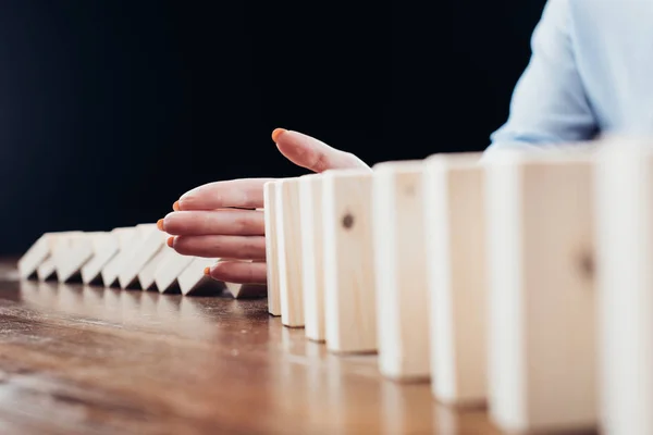 Selective Focus Woman Sitting Desk Preventing Wooden Blocks Falling — Stock Photo, Image