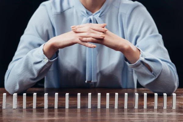 Partial View Woman Folded Hands Domino Row Isolated Black — Stock Photo, Image