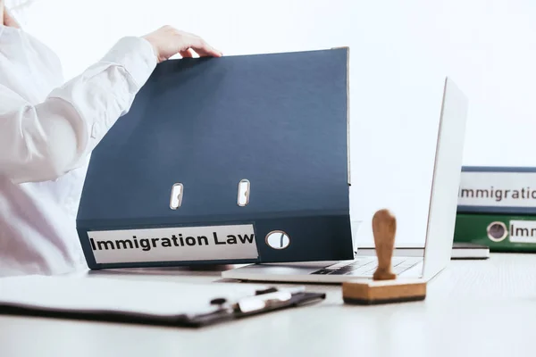 Selective Focus Woman Opening Folder Immigration Law Lettering Laptop Isolated — Stock Photo, Image