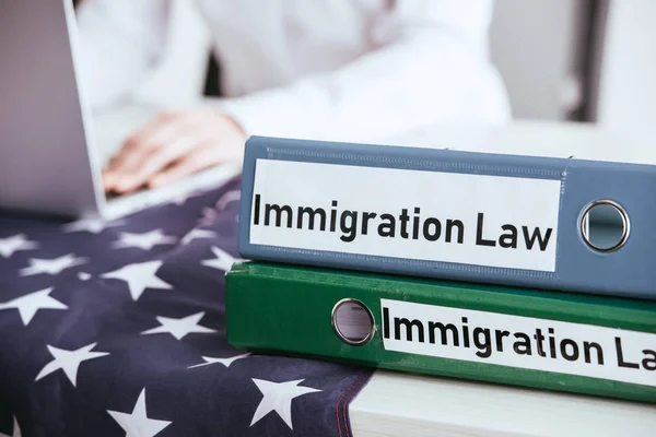 Selective Focus Folders Immigration Law Lettering Woman Using Laptop Background — Stock Photo, Image