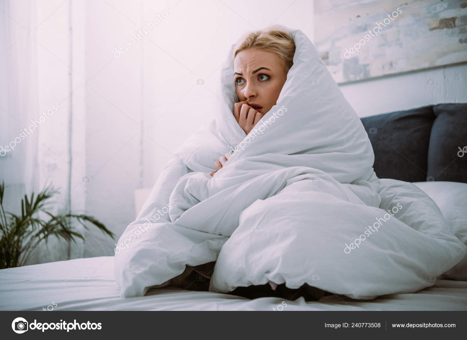 Frightened Woman Covered Blanket Biting Hand Bed Home Stock Photo AndrewLozovyi 240773508