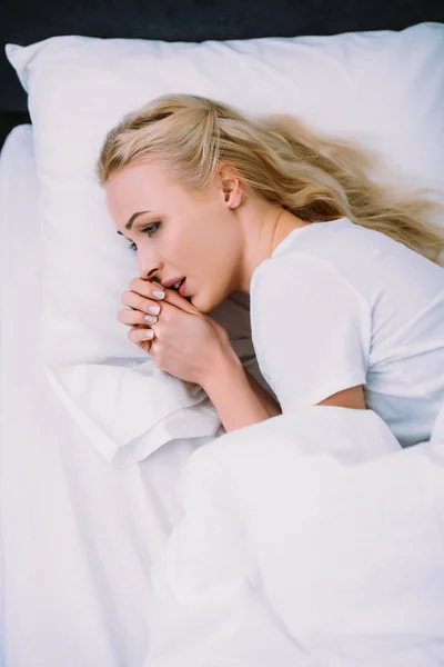 Selective Focus Scared Woman Folded Hands Lying Bed Home — Stock Photo, Image