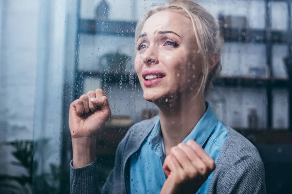 Sad Adult Woman Crying Clenched Fists Home Window Raindrops — Stock Photo, Image