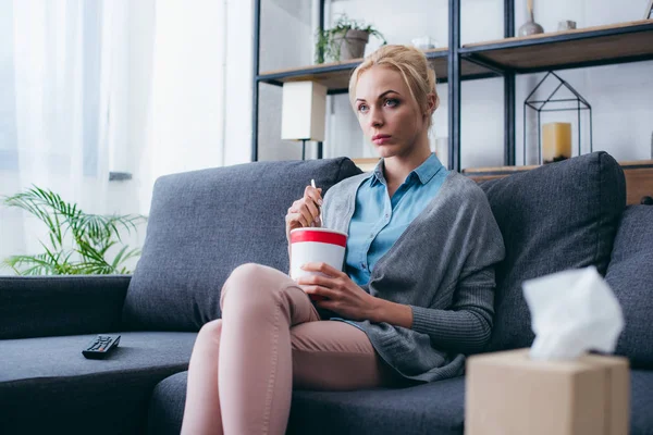 Sad Woman Eating Ice Cream While Siitng Couch Watching Home — Stock Photo, Image