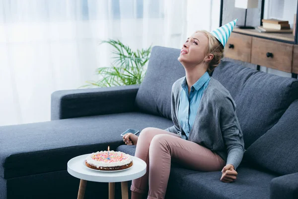 Frustrated Woman Party Hat Celebrating Birthday Home Alone — Stock Photo, Image