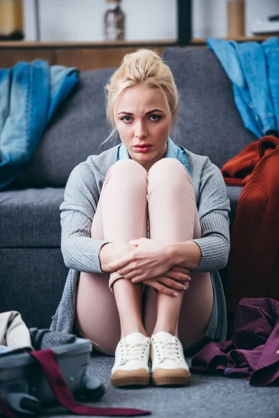 Sad Woman Sitting Scattered Clothes Breaking Boyfriend Looking Camera — Stock Photo, Image