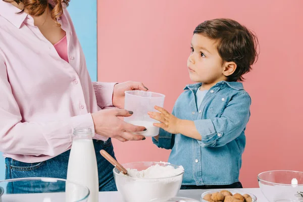 Cute Little Boy Mom Holding Measuring Cup Flour Bicolor Background — Stock Photo, Image