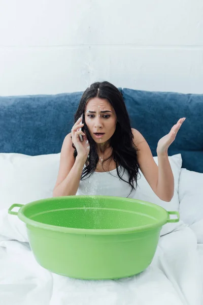 Shocked Woman Talking Smartphone While Dealing Water Leak Bedroom — Stock Photo, Image