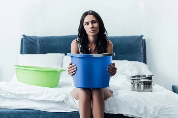 Tired Woman Holding Big Bucket Sitting Bed — Stock Photo, Image
