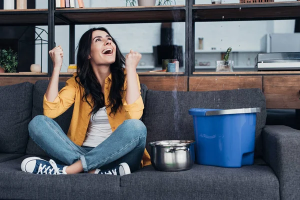 Laughing Woman Jeans Sitting Sofa Looking — Stock Photo, Image