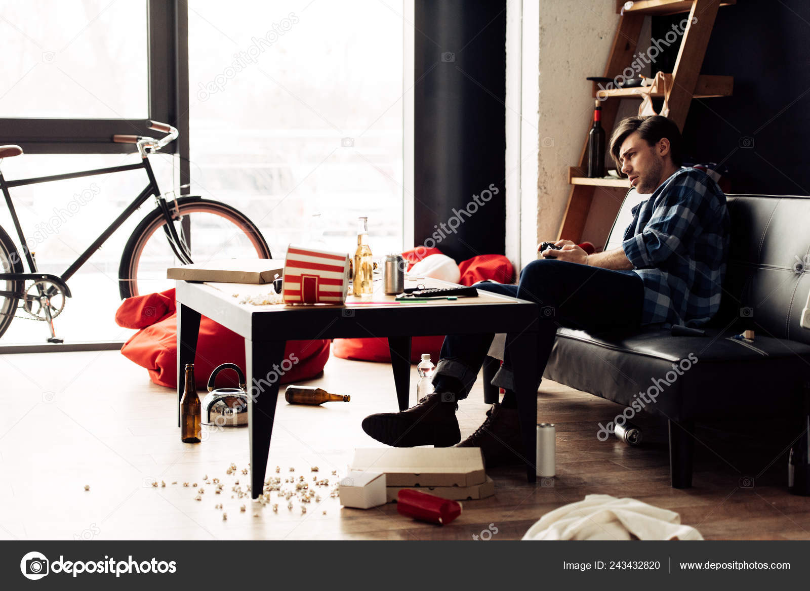 Man Playing Video Game Messy Living Room Stock Photo