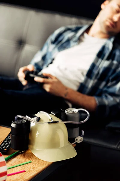 Selective Focus Beer Helmet Man Sleeping Holding Joystick Background — Stock Photo, Image