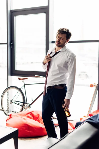 Tired Man Suffering Hangover Standing Bottle Hand — Stock Photo, Image