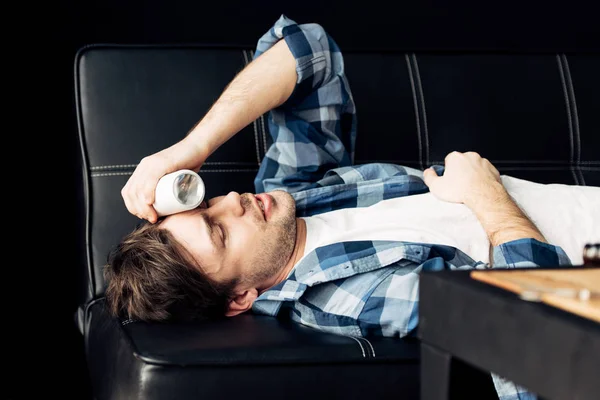 Man Lying Sofa Holding Bottle Head Party — Stock Photo, Image