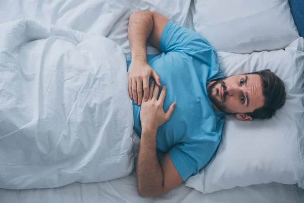 Top View Sad Lonely Man Looking Camera Lying Bed Home — Stock Photo, Image