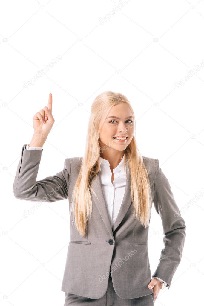 beautiful smiling businesswoman having idea and pointing up, isolated on white