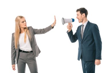 businessman screaming into megaphone at businesswoman who showing stop gesture isolated on white, gender equality concept clipart