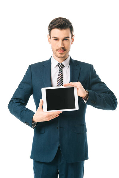 handsome businessman holding digital tablet with blank screen isolated on white
