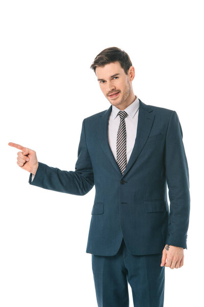 successful businessman pointing at something isolated on white