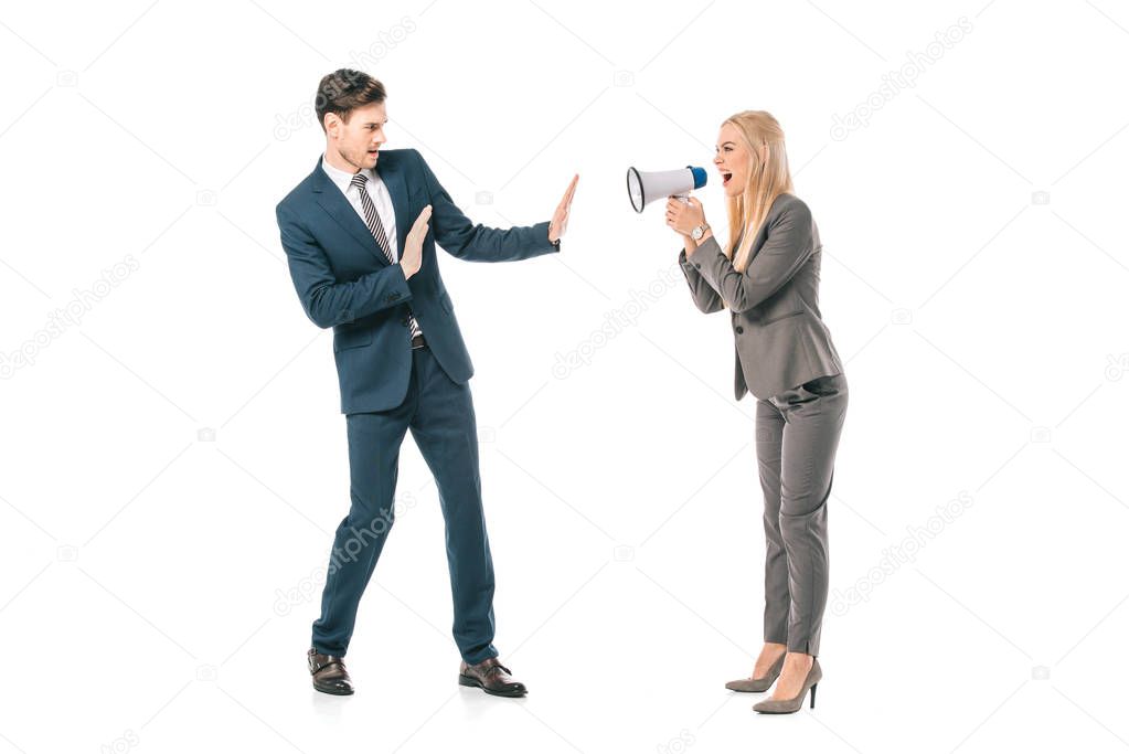 angry businesswoman screaming into megaphone at frightened businessman isolated on white