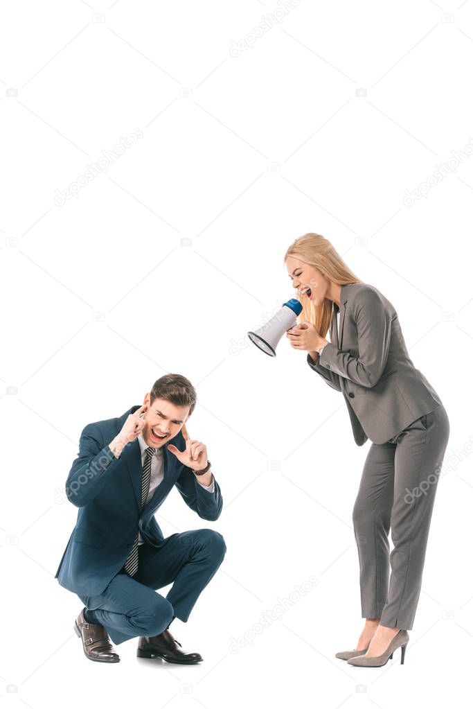 angry female boss yelling into megaphone at stressed businessman isolated on white