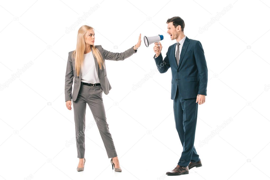 male boss shouting into megaphone at businesswoman who showing stop gesture isolated on white, gender equality concept