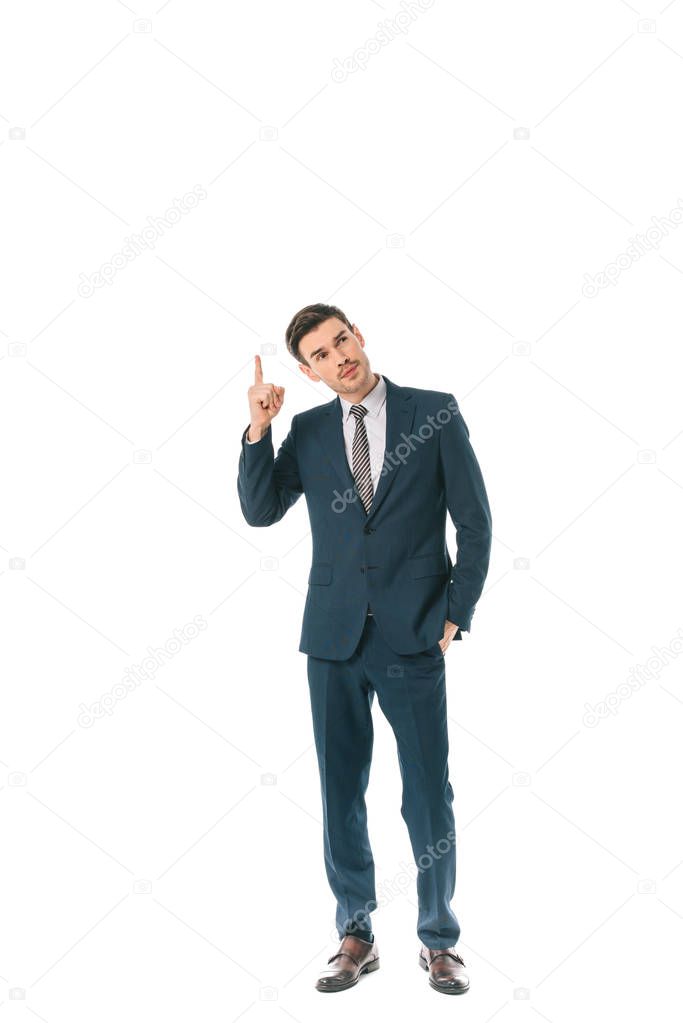 pensive businessman pointing up isolated on white