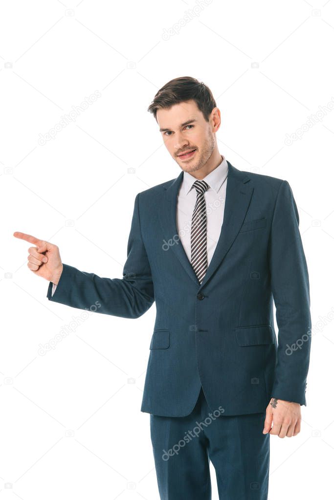 successful businessman pointing at something isolated on white