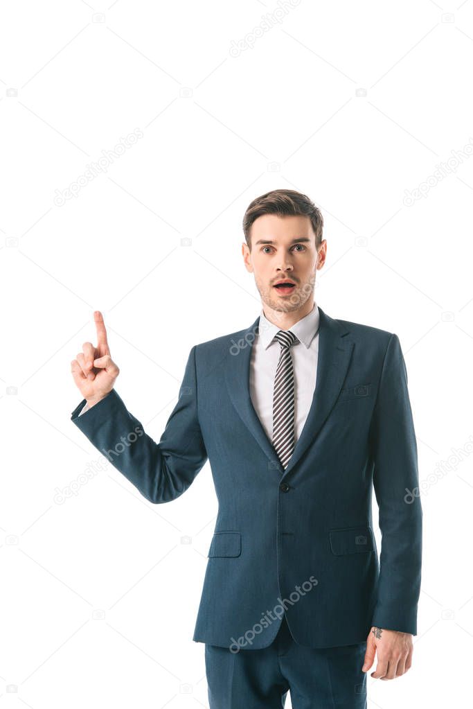 shocked businessman having idea and pointing up isolated on white